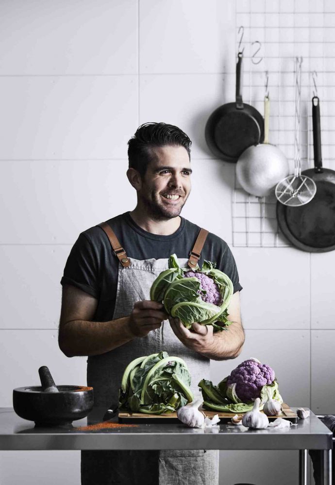Adam Wolfers creating his roasted purple cauliflower with harissa, macadamia and pickled currants recipe.