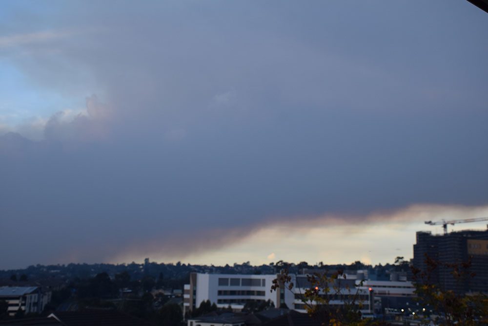 Backburning smoke hovering over suburban Sydney,