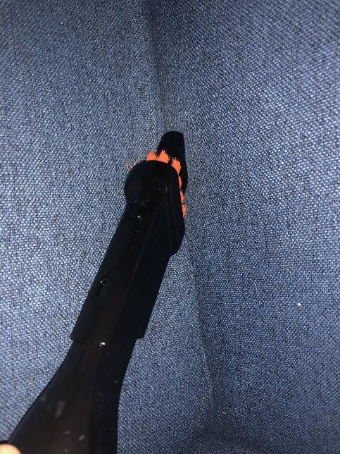 Cleaning an armchair with the BISSELL SpotClean Turbo Professional Portable Carpet & Upholstery Washer.