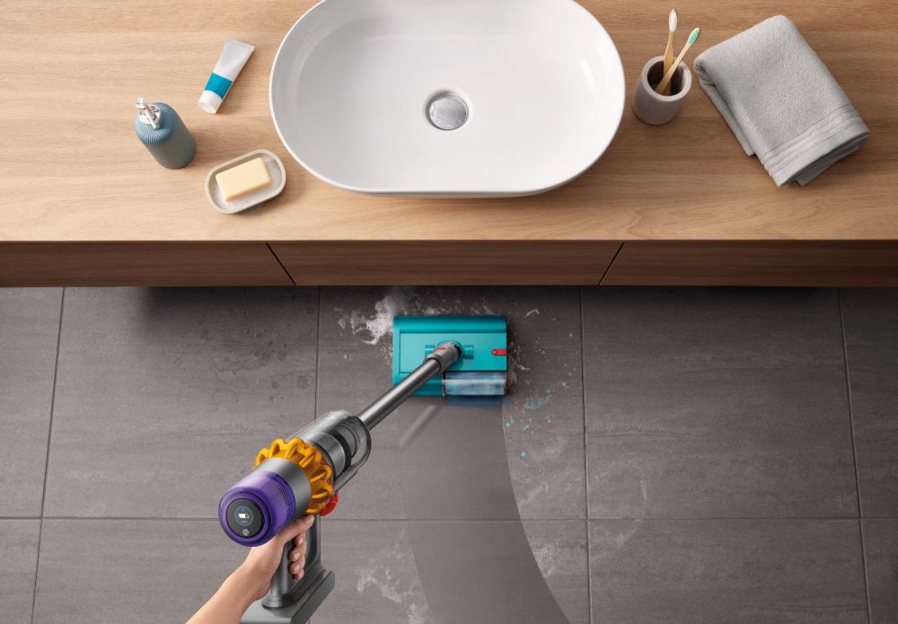 Cleaning a bathroom floor with the Dyson V15S Submarine Wet Roller Head.