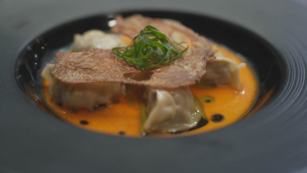 Quail + Nectarine Dumplings in a bowl.