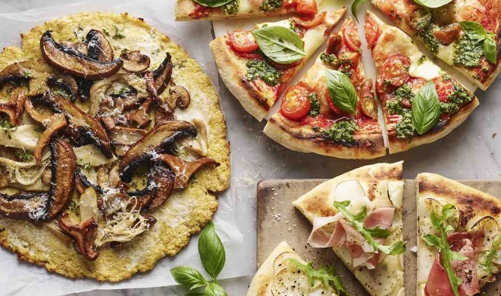 Three pizzas with cauliflower bases.
