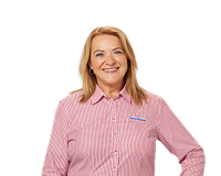 Female Harvey Norman staff member wearing red striped uniform smiling against white background