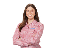 Friendly Harvey Norman team member in light blue uniform shirt