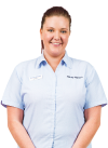 Friendly Harvey Norman team member in light blue uniform shirt