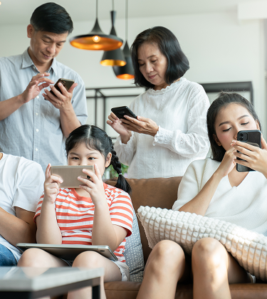 Family members using multiple devices with home Wi-Fi powered by Wi-Fi 7 router 