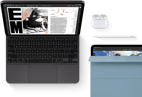 iPad Pro attached to Magic Keyboard, front exterior, space black colour, rounded corners, black display bezel, open, display showing article editing app with text and photograph of a woman playing music, AirPods 4 in open case, blue Smart Folio cover on iPad Pro with Apple Pencil Pro resting atop device, cover slightly open revealing display