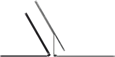 Two iPad Pro devices attached to Magic Keyboard, side exterior, thin profile, space black colour with speakers and USB-C port, tilted half open, silver colour, open, tilted back showing the keyboard’s floating cantilevered design, speakers and microphone