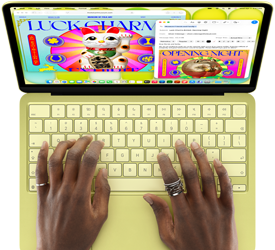 MacBook Neo, citrus colour, hands on keyboard, user is composing an email invitation to a sports event, website for the event open alongside